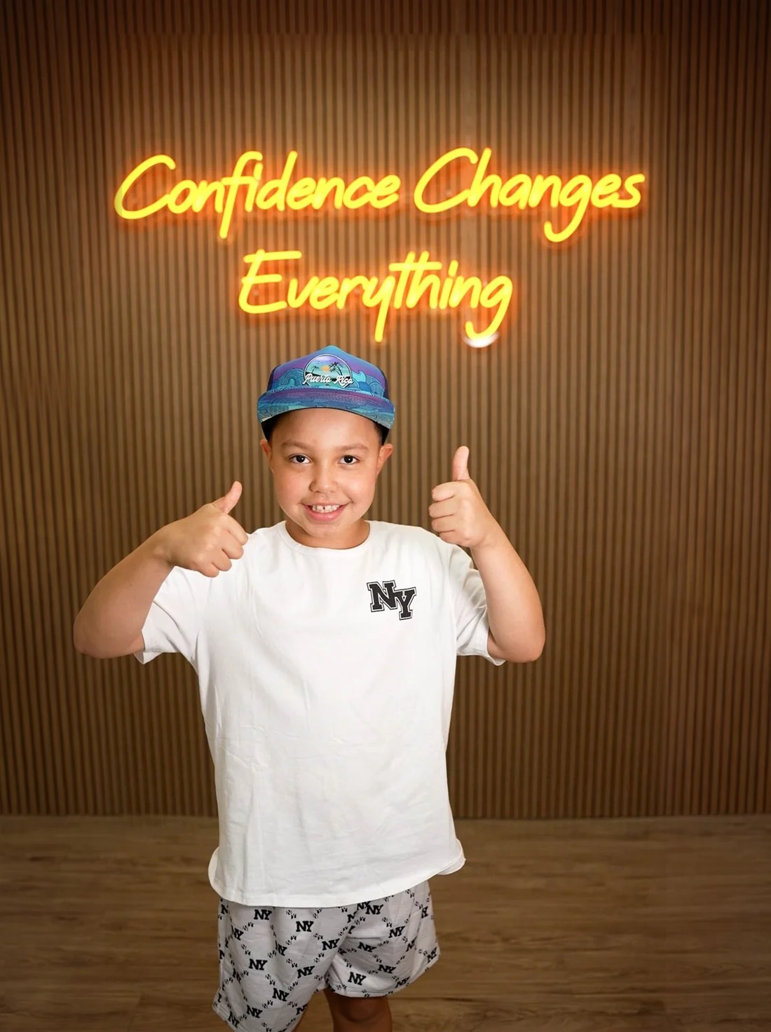 A young CDZ Ortho patient giving two thumbs up