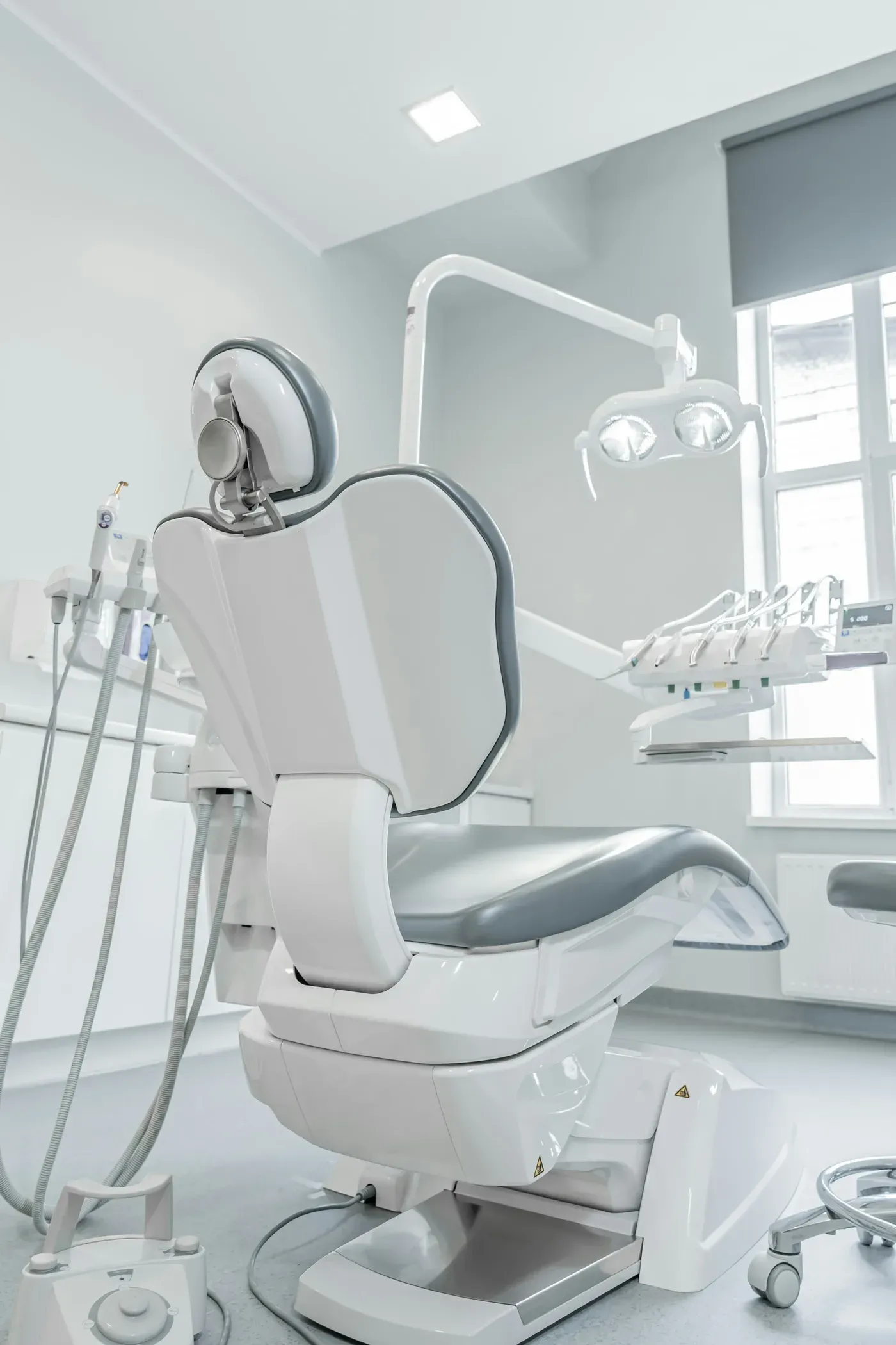 White treatment chair beside a window