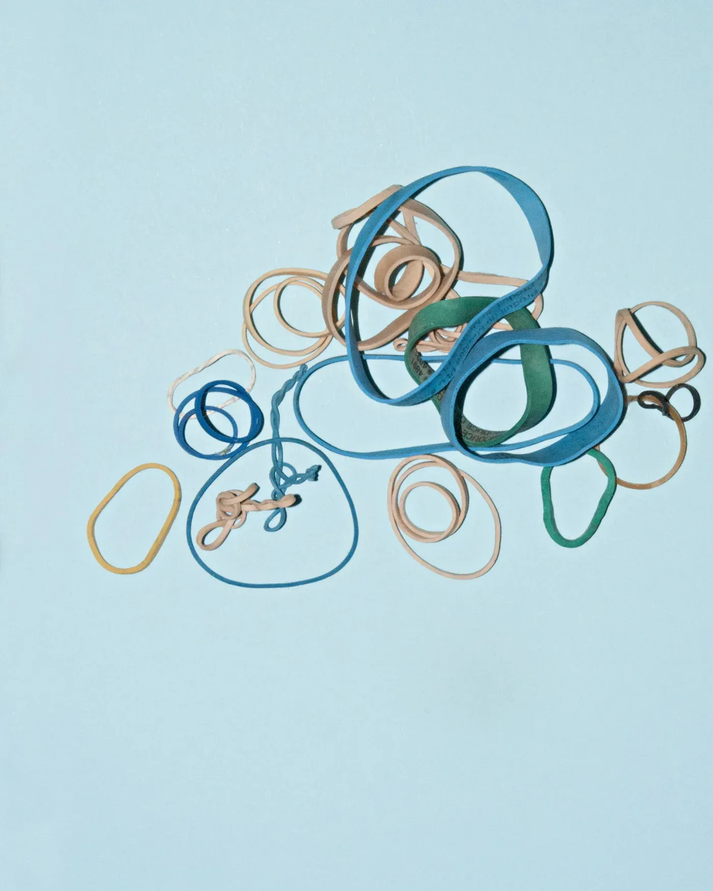 Colored elastic bands on a blue background